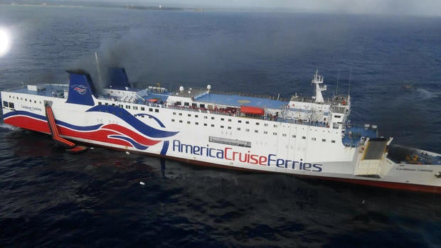 Smoke rises from a ship that runs between Puerto Rico and the Dominican Republic Aug. 17, 2016.