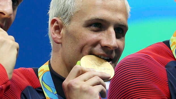 Ryan Lochte and his teammates appear with their gold medals after the men’s 4x200m freestyle relay final in the Rio 2016 Summer Olympic Games at Olympic Aquatics Stadium Aug 9, 2016, in Rio de Janeiro, Brazil.