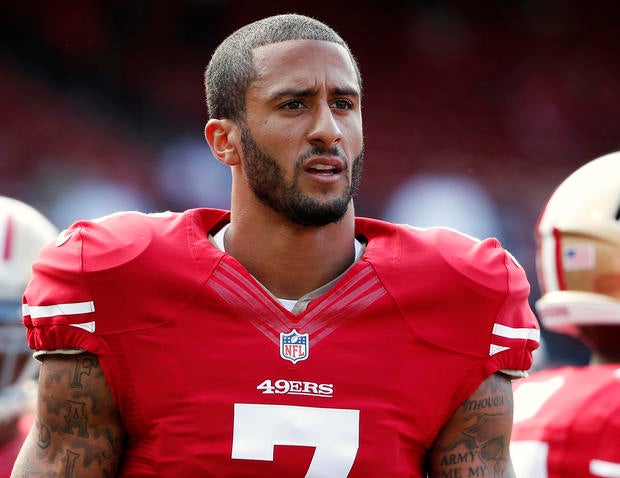 San Francisco 49ers quarterback Colin Kaepernick stands on the field before an NFL preseason football game against the Denver Broncos in San Francisco, California, August 8, 2013.