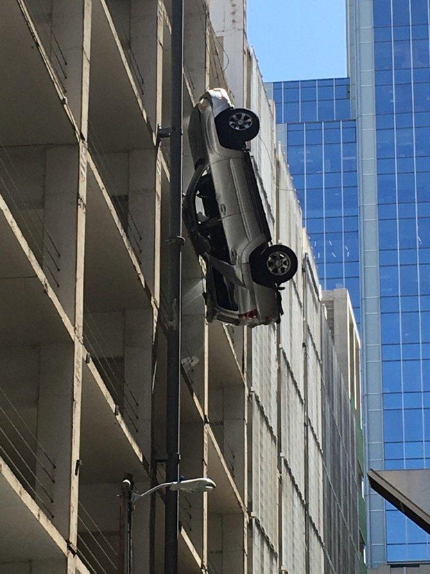 Car dangles off parking garage in downtown Austin CBS News