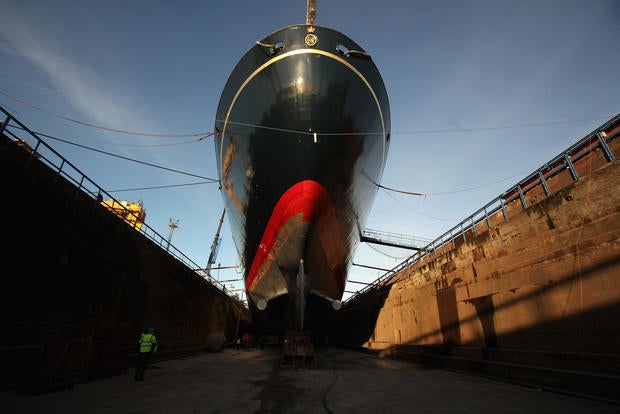 Workmen carry out painting and repairs on the Royal Yacht Britannia in a dry dock at Forth Ports