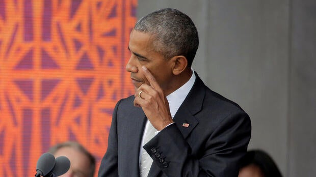 President Obama wipes his cheek as he speaks during the dedication of the Smithsonian’s National Museum of African American History and Culture in Washington, Sept. 24, 2016.