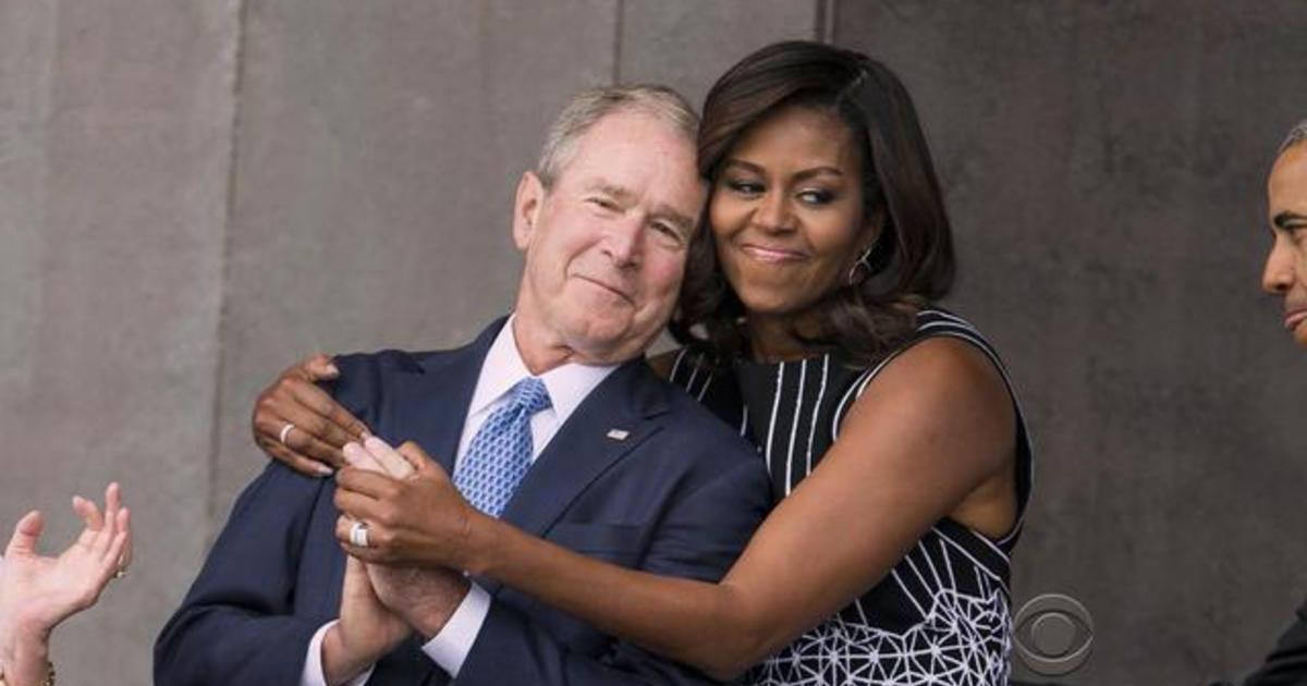 Bonding Moment Between Former President Bush And Michelle Obama Cbs News