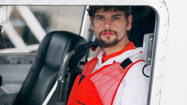 Nathan Carman arrives in a small boat at the U.S. Coast Guard station in Boston Sept. 27, 2016. Carman spent a week at sea in a life raft before being rescued by a passing freighter.