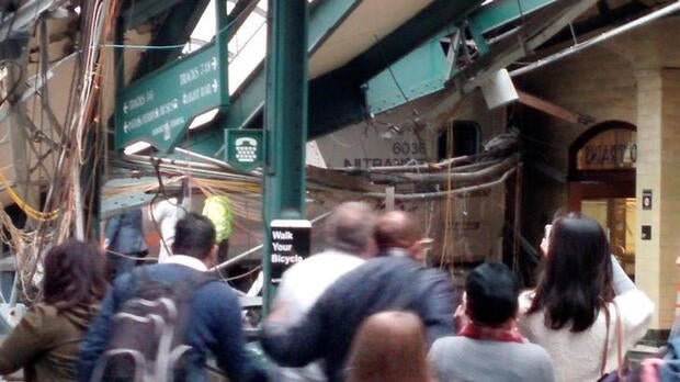 Onlookers view a New Jersey Transit train that derailed and crashed through the station in Hoboken, New Jersey, in this picture courtesy of Chris Lantero taken Sept. 29, 2016.