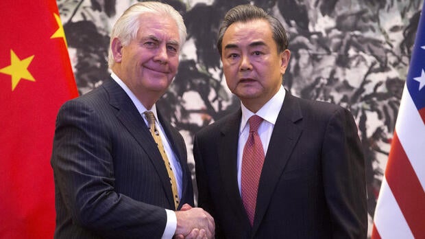 U.S. Secretary of State Rex Tillerson and Chinese Foreign Minister Wang Yi shake hands at the end of a joint press conference at the Diaoyutai State Guesthouse in Beijing, China, March 18, 2017.