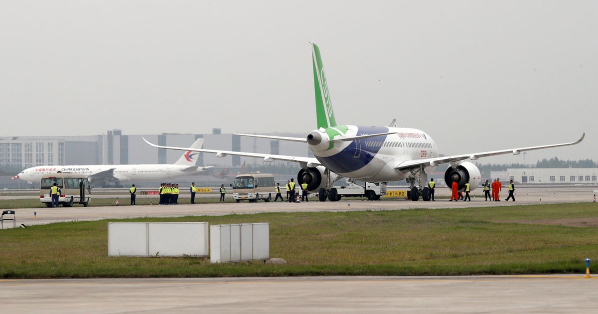 china-s-first-large-passenger-jet-makes-its-maiden-flight-cbs-news