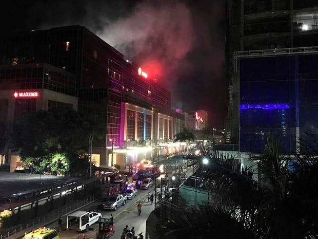 Smoke rises from the Resorts World Manila complex early June 2, 2017, in Manila, Philippines.