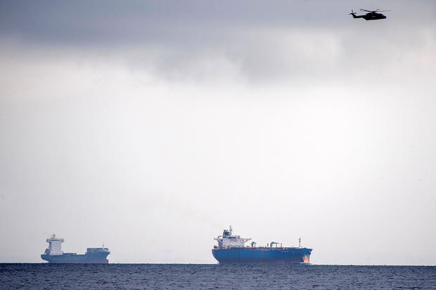 A helicopter searches the area off of Copenhagen Harbour where the Nautilus, considered the largest privately built submarine of its kind, was reported missing near Copenhagen, Denmark, Aug. 11, 2017. 