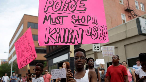 People continue to march after the not-guilty verdict in the murder trial of Jason Stockley, a white former St. Louis police officer, in the 2011 shooting of Anthony Lamar Smith, a black man, in St. Louis, Missouri, Sept. 17, 2017.