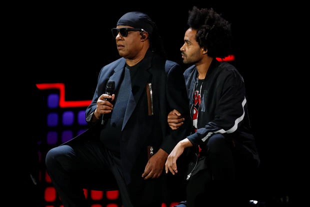 Singer Stevie Wonder takes a knee before performing at the 2017 Global Citizens Festival at Central Park in New York