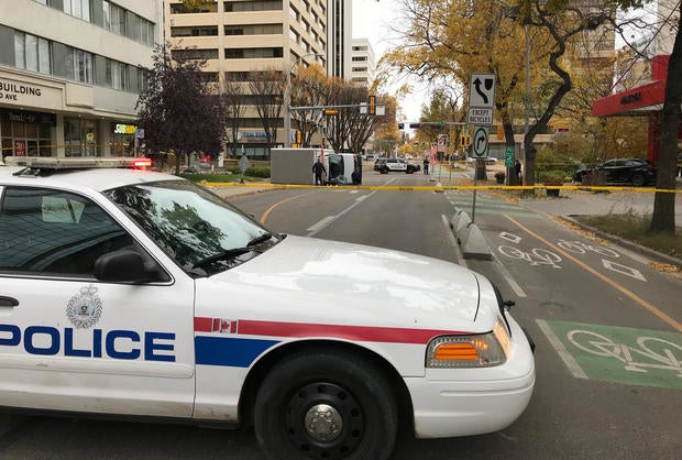 Edmonton Police investigate at the scene where a man hit pedestrians then flipped the U-Haul truck in Edmonton