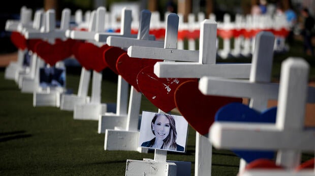 A photograph hangs from one of the 58 white crosses set up for the victims of the Route 91 Harvest music festival mass shooting in Las Vegas, Nevada, Oct. 5, 2017.