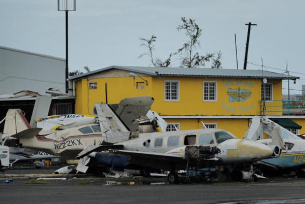 Damaged planes stand piled up near the airport of Isla Grande 