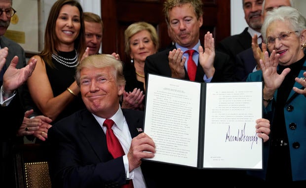 Trump signs an Executive Order on healthcare at the White House in Washington
