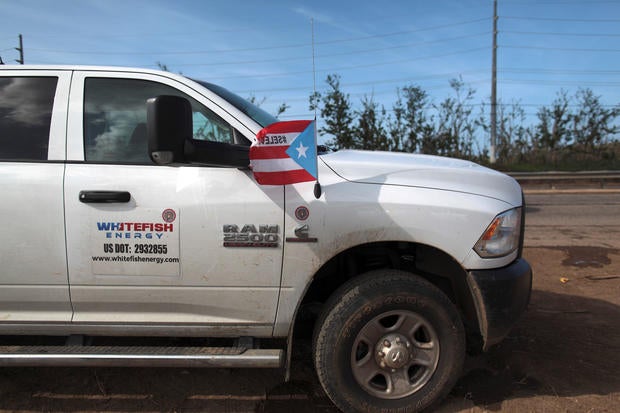 A pick up from Montana-based Whitefish Energy Holdings is parked as workers help fix the island's power grid, damaged during Hurricane Maria in September, in Manati