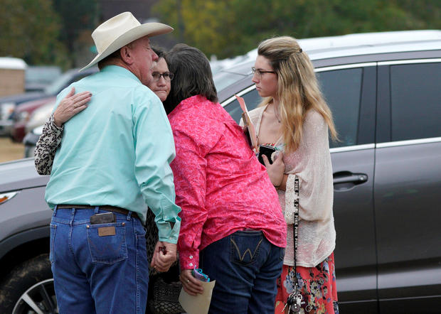 People hug after the First Baptist Church of Sutherland Springs worship service, the first service since a gunman opened fire inside the church a week earlier in Sutherland Springs 