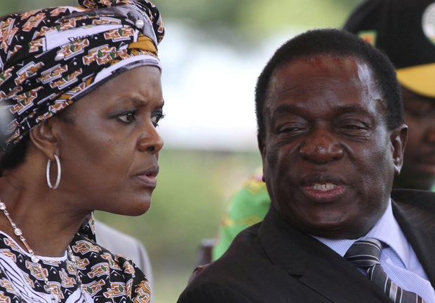 FILE PHOTO: President Robert Mugabe's wife Grace Mubage and vice-President Emmerson Mnangagwa attend a gathering of the ZANU-PF party's top decision making body, the Politburo, in the capital Harare