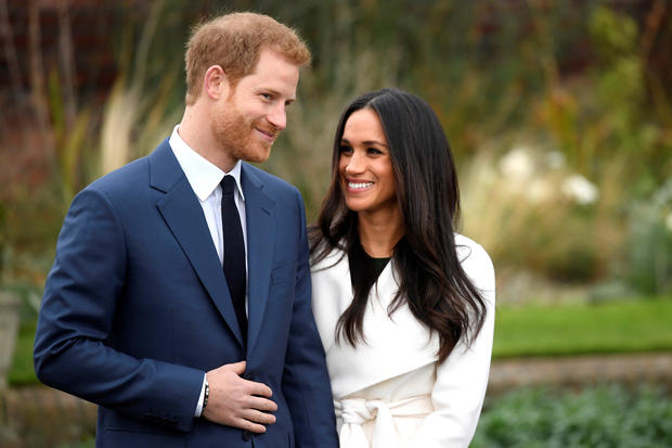 Britain's Prince Harry poses with Meghan Markle in the Sunken Garden of Kensington Palace, London 