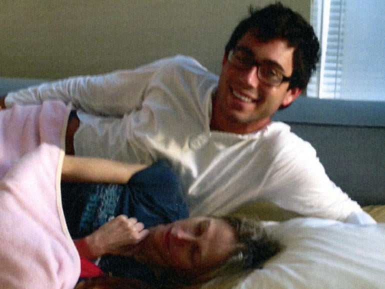 Jake Nolan and Dr. Pamela Buchbinder in her bed