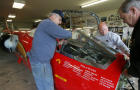 From left, Von Armstrong, Richard Pengelley and Ed Shadle set the windshield down onto the front of the North American Eagle jet-powered vehicle May 3, 2008, in Spanaway, Wash. A handful of Snohomish County residents are part of a team of airplane mechanics, speed junkies and military veterans who are converting a 1960s-era F-104 Starfighter into a supersonic driving machine. 