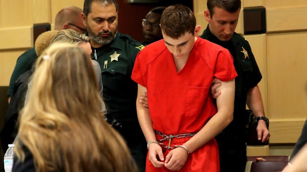 Nikolas Cruz, facing 17 charges of premeditated murder in the mass shooting at Marjory Stoneman Douglas High School in Parkland, Florida, appears in court for a status hearing before Broward Circuit Judge Elizabeth Scherer in Fort Lauderdale Feb. 19, 2018