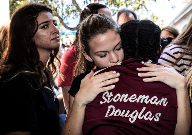 FILE PHOTO: Students from Marjory Stoneman Douglas High School attend a memorial following a school shooting incident in Parkland 