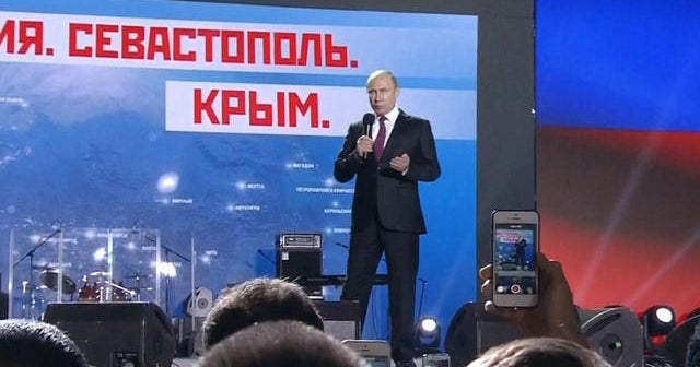 Vladimir Putin campaigns in disputed territory of Crimea