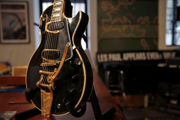 The Les Paul guitar known as "Black Beauty", which will go up for auction next month, is seen in the offices of Guernsey's Auctions President Arlan Ettinger in New York