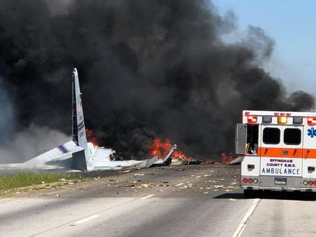 Crews work the scene after a plane crashed on a road in Savannah, Georgia, on May 2, 2018. 
