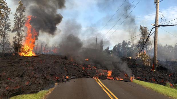 Lava advances along a street near a fissure in Leilani Estates, on Kilauea Volcano's lower East Rift Zone in Hawaii May 5, 2018. 