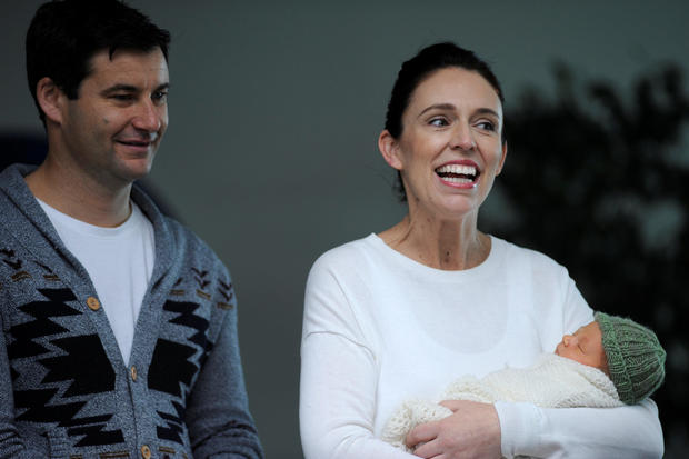 New Zealand Prime Minister Jacinda Ardern carries her newborn baby as she walks out of the Auckland Hospital in New Zealand 