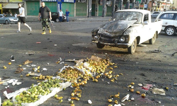 Damages after a suicide bomb attack are seen in Sweida