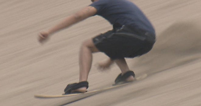 Sandboarding Hitting slopes of sand CBS News