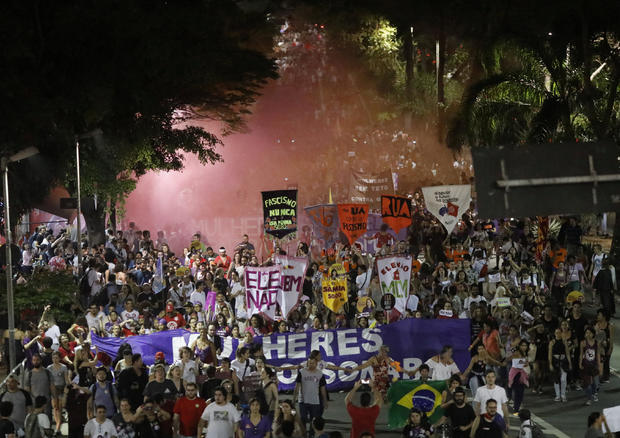People march during a demonstration against Brazil's presidential candidate Jair Bolsonaro, in Sao Paulo, Brazil 