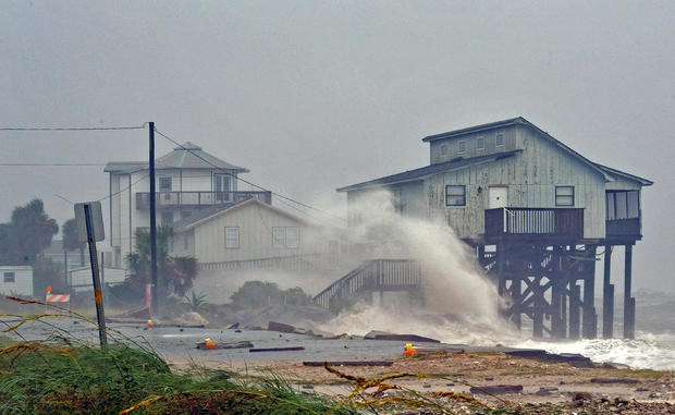 Waves crash on stilt houses along the shore due to Hurricane Michael at Alligator Point in Franklin County 