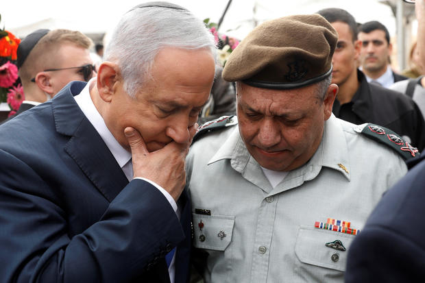 Israeli Prime Minister Benjamin Netanyahu chats with Israeli Chief of Staff Lieutenant-General Gadi Eizenkot as they wait for an annual state memorial ceremony for Israel Prime Minister David Ben Gurion at his gravesite in Sde Boker 