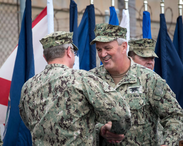Rear Adm. Collin Green, center right, shakes the hand of Rear Adm. Tim Szymanski after relieving him as commander of Naval Special Warfare Command during a change of command ceremony at Naval Amphibious Base Coronado in California Sept. 7, 2018. 