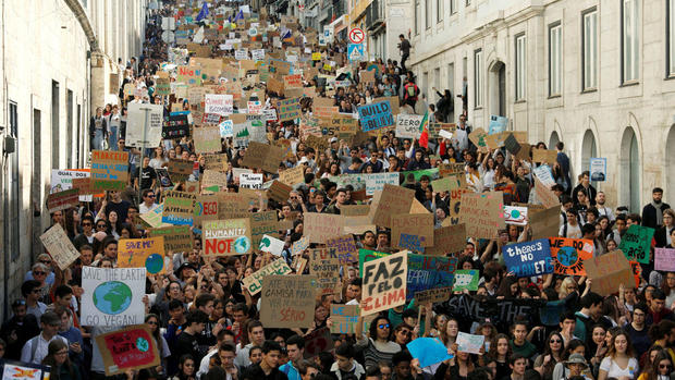Students around the world march against inaction on climate change 