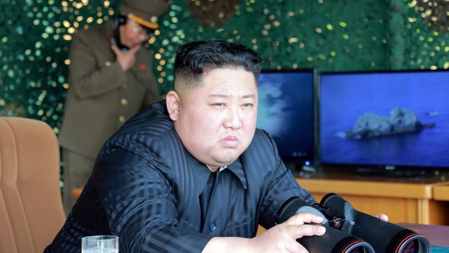 North Korea's leader Kim Jong Un supervises a "strike drill" for multiple launchers and tactical guided weapon into the East Sea during a military drill in North Korea