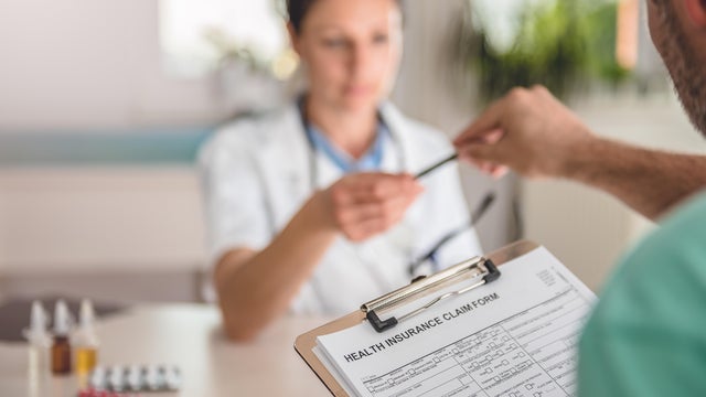 Patient filing health insurance claim form 