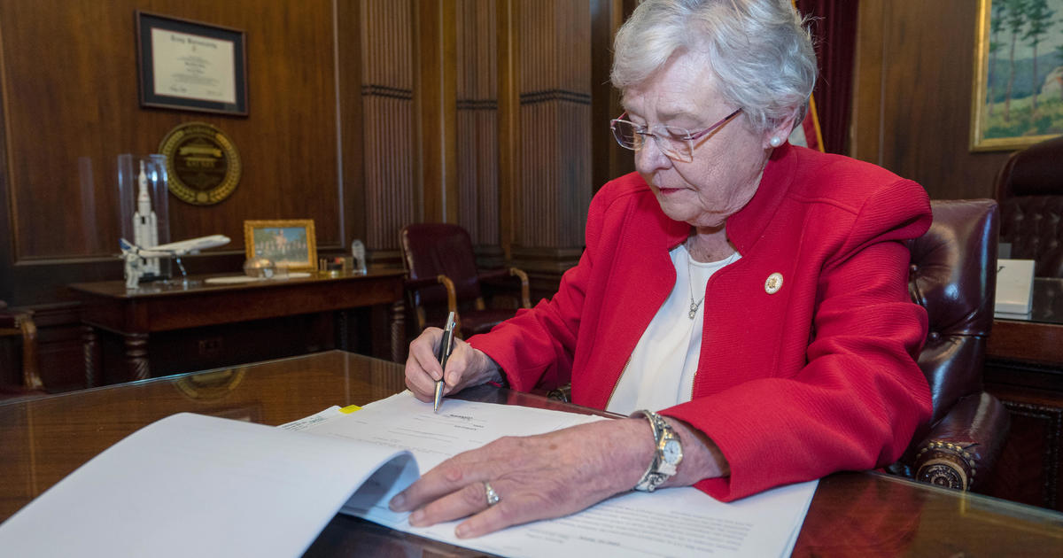 Alabama governor signs near-total abortion ban into law