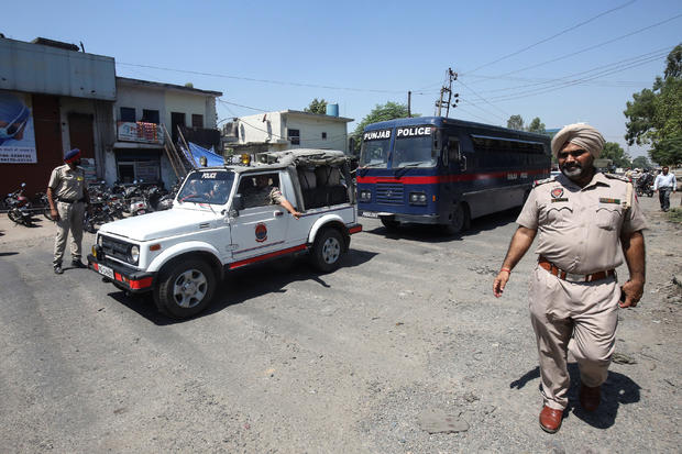 A police bus carrying the men accused of rape and murder of an eight-year-old girl in Kathua, near Jammu, arrives at a court in Pathankot 