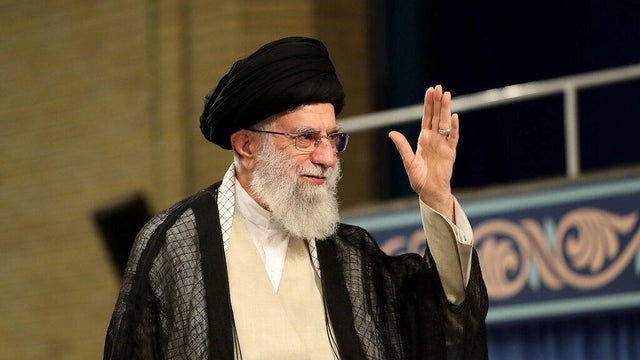 Iran's Supreme Leader Ayatollah Ali Khamenei waves during ceremony attended by Iranian clerics in Tehran 
