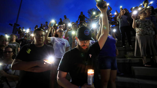 Francisco Castaneda joins mourners taking part in a vigil at El Paso High School after a mass shooting at a Walmart store in El Paso, Texas, Aug. 3, 2019. 