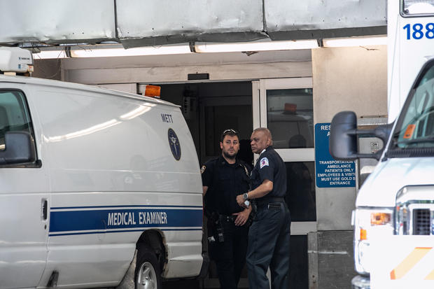 Police officers stand outside New York Presbyterian-Lower Manhattan Hospital, where Jeffrey Epstein's body was transported before being moved to Medical examiners Office in Manhattan borough of New York City 