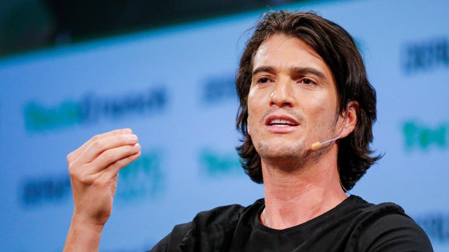 FILE PHOTO: Neumann, CEO of WeWork, speaks to guests during the TechCrunch Disrupt event in Manhattan, in New York City