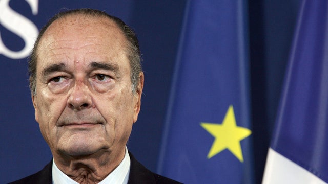 French President Jacques Chirac listens 