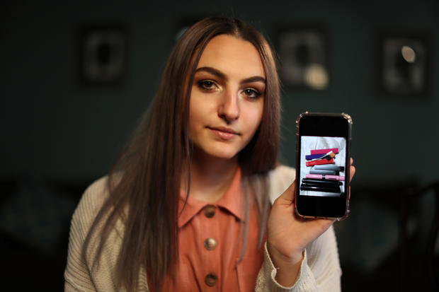 Simah Herman, 18, poses with a photo of her former vaping devices in her North Hollywood home, Los Angeles 
