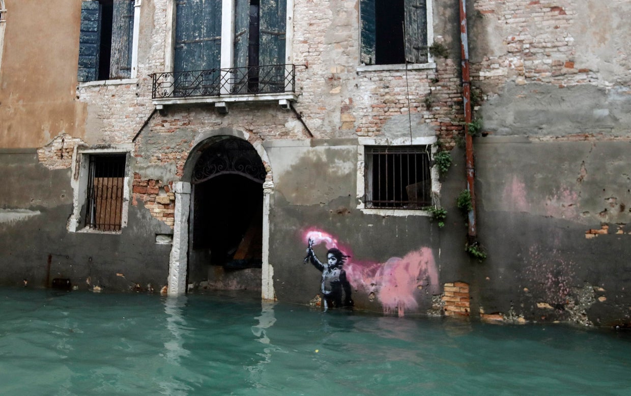 Venice flooding Banksy artwork of a refugee in a life jacket is now